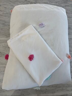 White with colorful Pom-Pom Dot Cotton Duvet Cover set. 61” x 85”